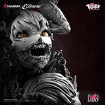 Close-up of a detailed monster figure with yellow eyes and a dark background, featuring Claymore Teresa vs Priscilla statue base details .