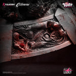 Decorative stone panel with intricate carvings of creatures, featuring FClaymore Teresa vs Priscilla statue base details. By Figurama collectors