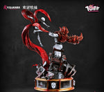 Detailed figurine with red hair and a dark background, featuring the brand 'Figurama'.Tokyo Ghoul Kaneki vs Yamori statue back angle